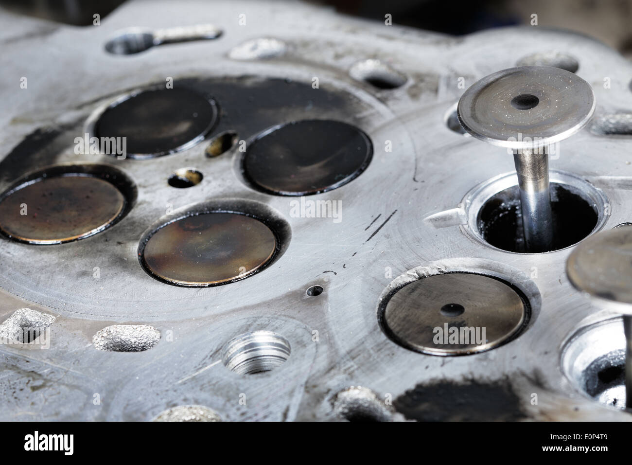 Worn out engine head with four valves per cylinder Stock Photo