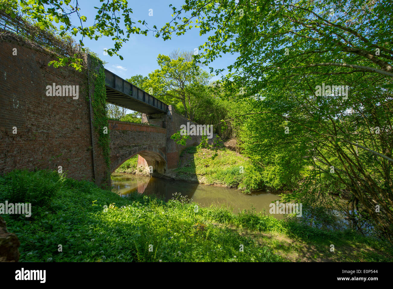 Rudgwick, West Sussex UK, Victorian disused two-tiered railway bridge over River Arun now carrying the Downs Link Path Stock Photo