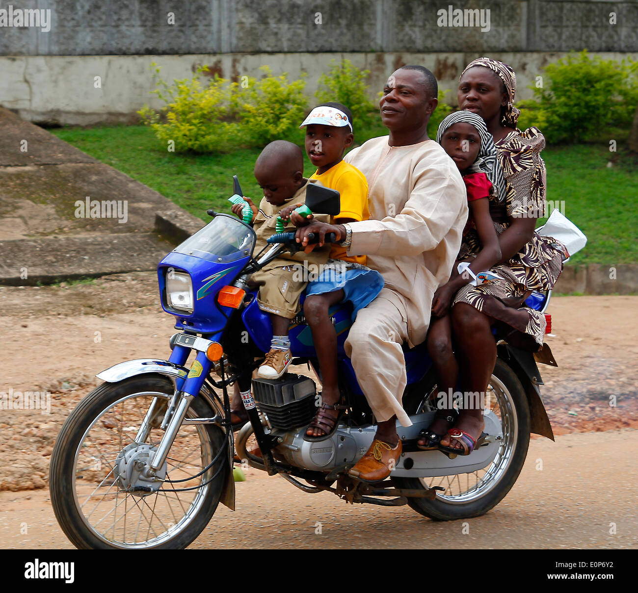 Nigerian family in a motorbike Stock Photo