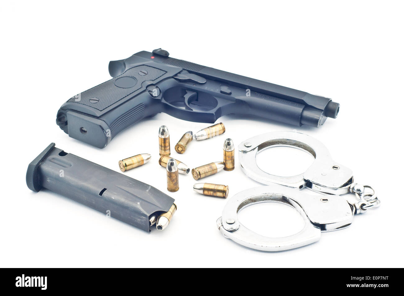 Gun bullet and handcuff isolated. Stock Photo