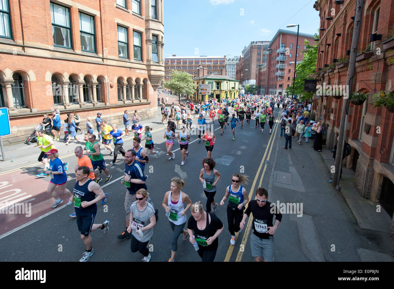 MANCHESTER, UK. 18th May 2014. Thousands of competitors take part in the 2014 Bupa Great Manchester Run, which is both an elite and mass participation event. Now in it's 12th year, it is Europe's biggest 10k running event. Credit:  Russell Hart/Alamy Live News. Stock Photo