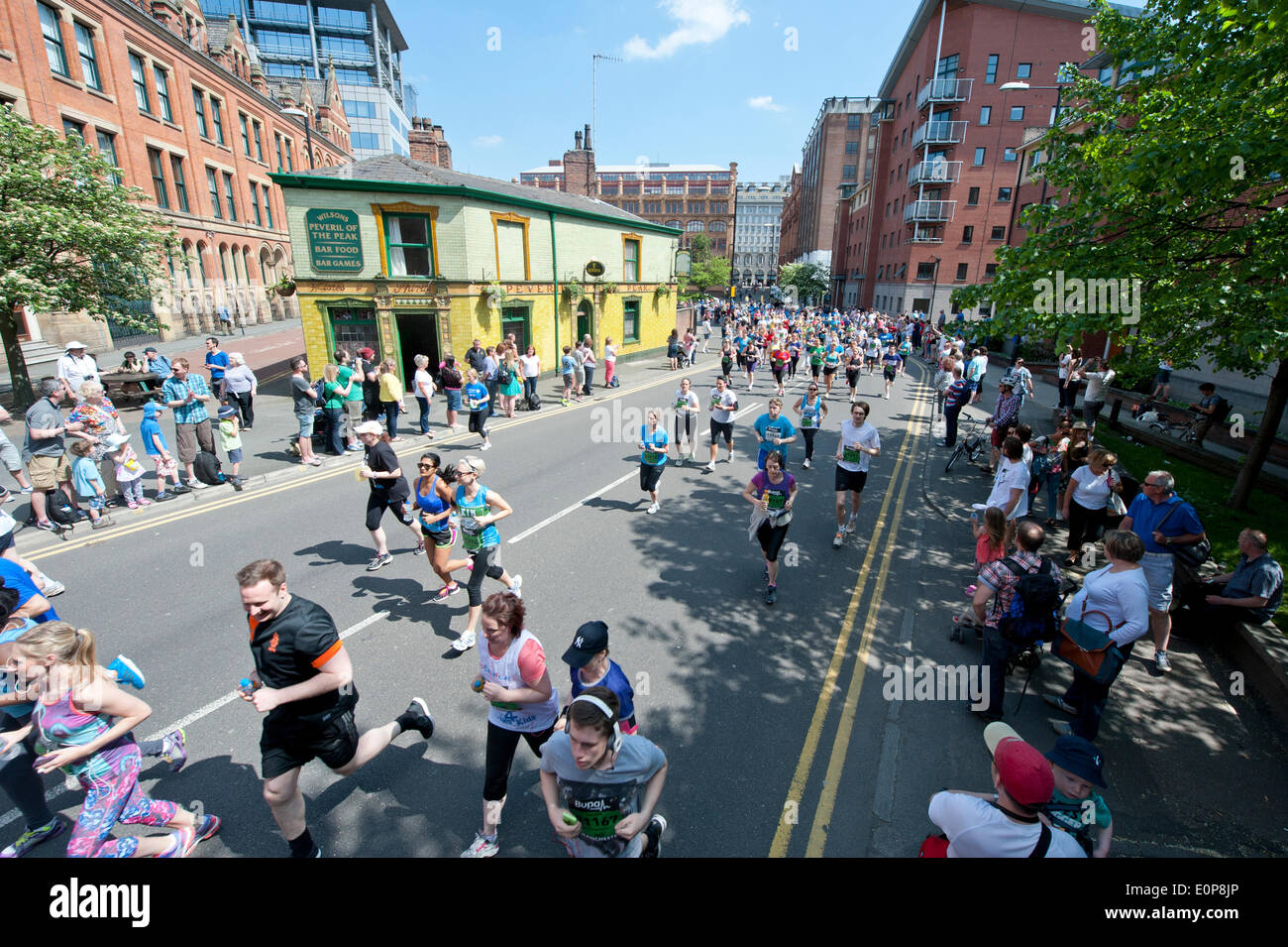 MANCHESTER, UK. 18th May 2014. Thousands of competitors take part in the 2014 Bupa Great Manchester Run, which is both an elite and mass participation event. Now in it's 12th year, it is Europe's biggest 10k running event. Credit:  Russell Hart/Alamy Live News. Stock Photo