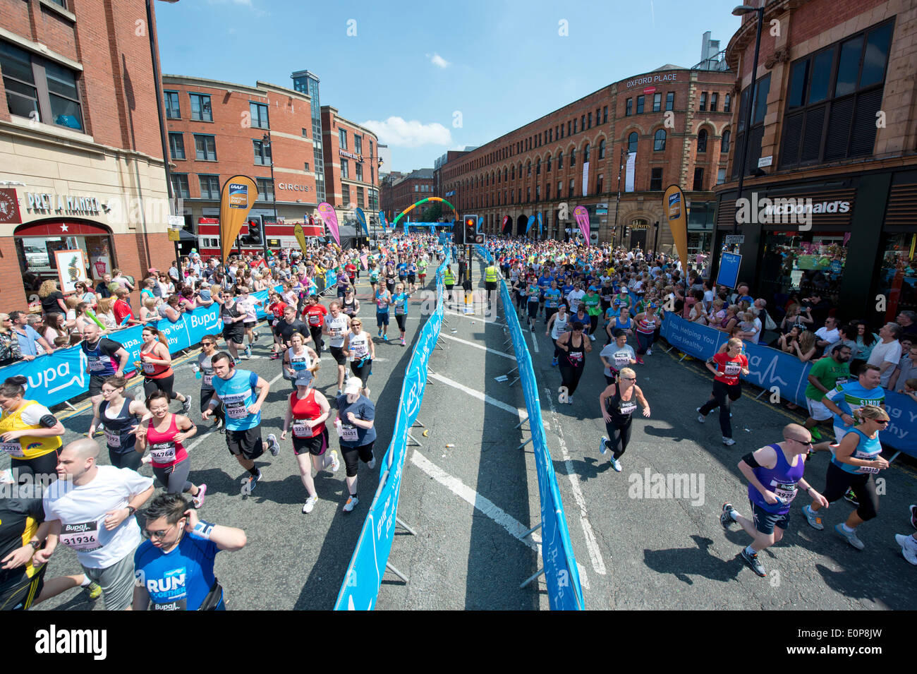 MANCHESTER, UK. 18th May 2014. Thousands of competitors take part in the 2014 Bupa Great Manchester Run, which is both an elite and mass participation event. Now in it's 12th year, it is Europe's biggest 10k running event. Credit:  Russell Hart/Alamy Live News. Stock Photo