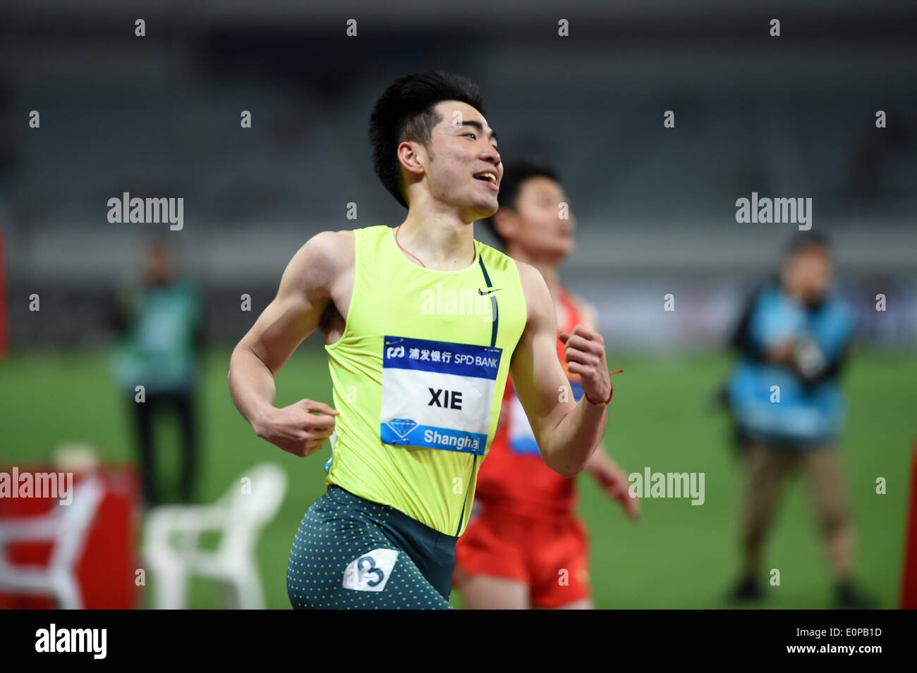 Shanghai, China. 18th May, 2014. China's Xie Wenjun corsses the finish line during the men's 110m hurdles race at the IAAF Diamond League Athletics in Shanghai, east China, May 18, 2014. © Li Jundong/Xinhua/Alamy Live News Stock Photo