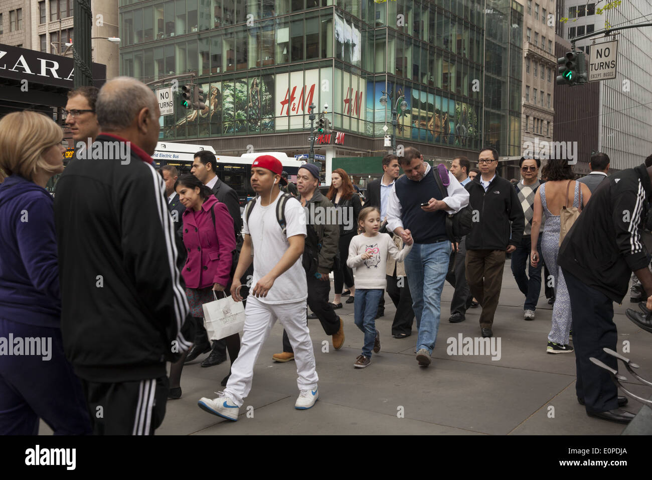 42nd St. near 5th Ave is always crowded with tourists, New Yorkers & office workers. NYC. Stock Photo