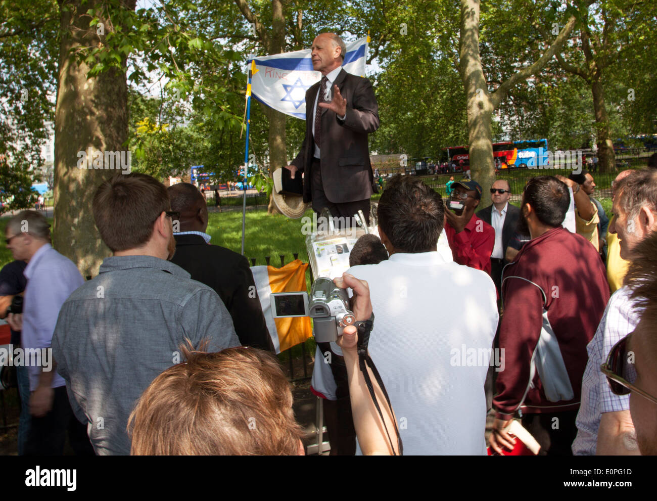 People listen to a speaker at Speakers Corner, Hyde Park, London Stock Photo