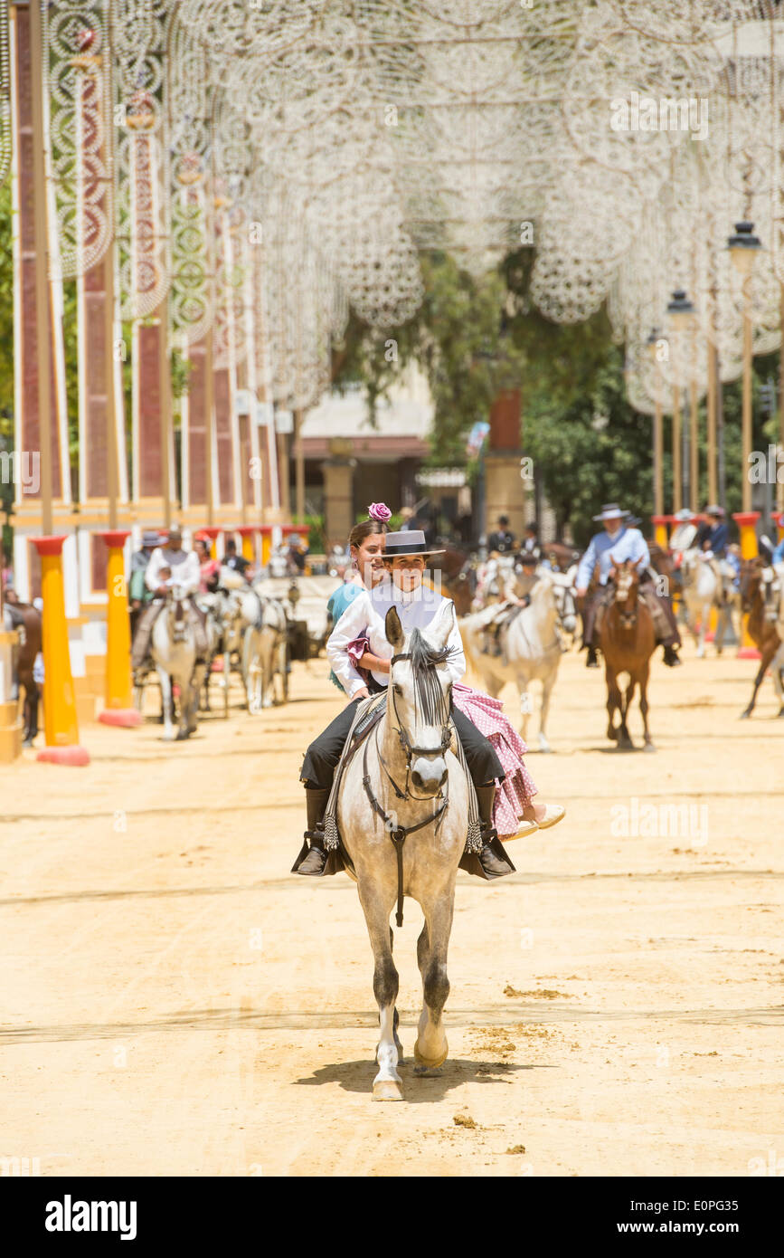 Jerez de la Frontera, Spain, 17 may, 2014: People mounted on horse on fair of Jerez. Credit:  Kiko Jimenez/Alamy Live News Stock Photo