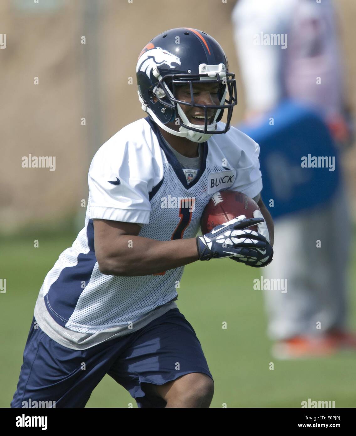 Englewood, Colorado, USA. 18th May, 2014. Denver Broncos RB DAMIEN THIGPEN goes through drills during the Rookie Camp at Dove Valley Saturday Morning. © Hector Acevedo/ZUMAPRESS.com/Alamy Live News Stock Photo