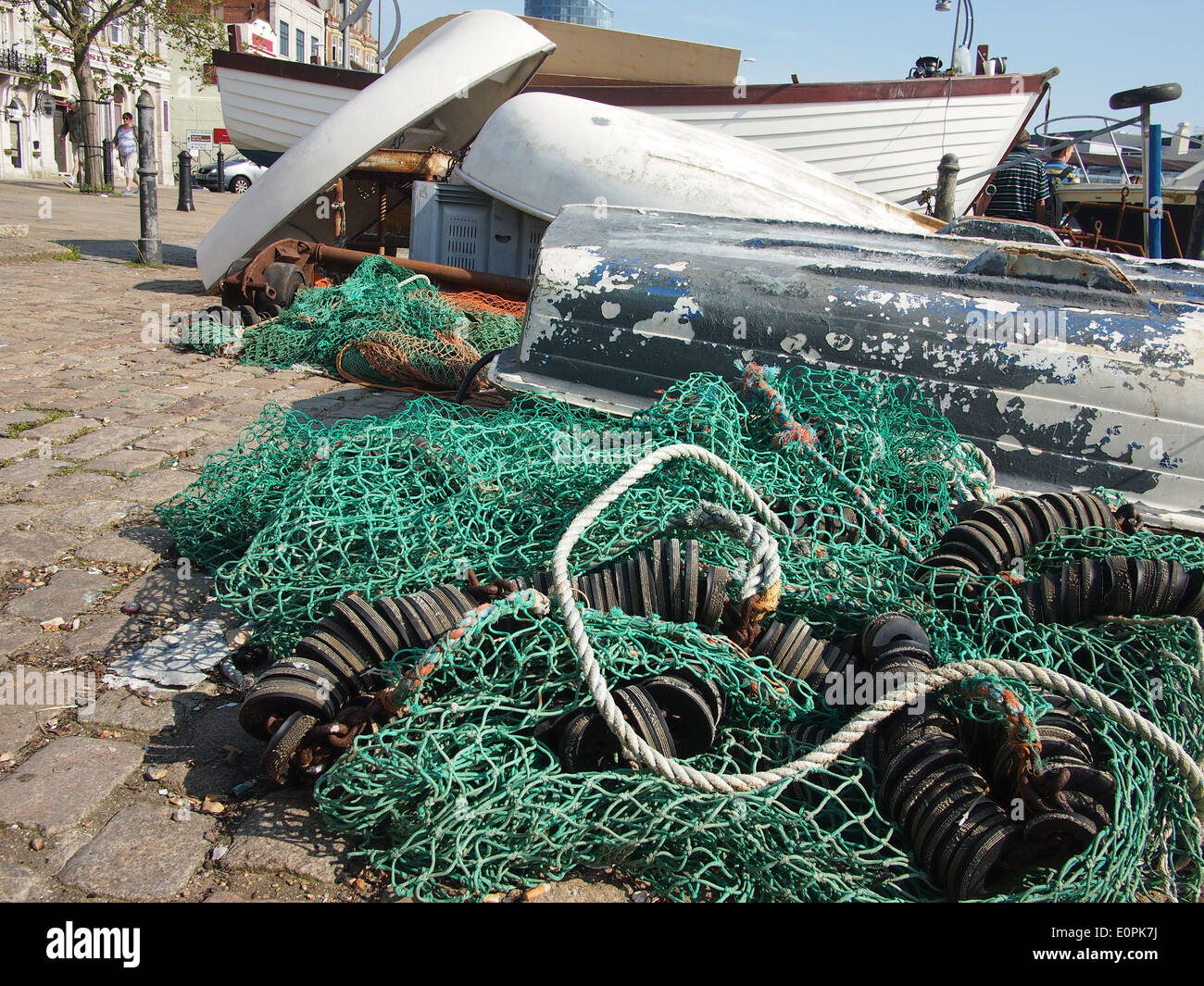 Boats and fishing nets on The Hard, Portsmouth Harbour, England Stock