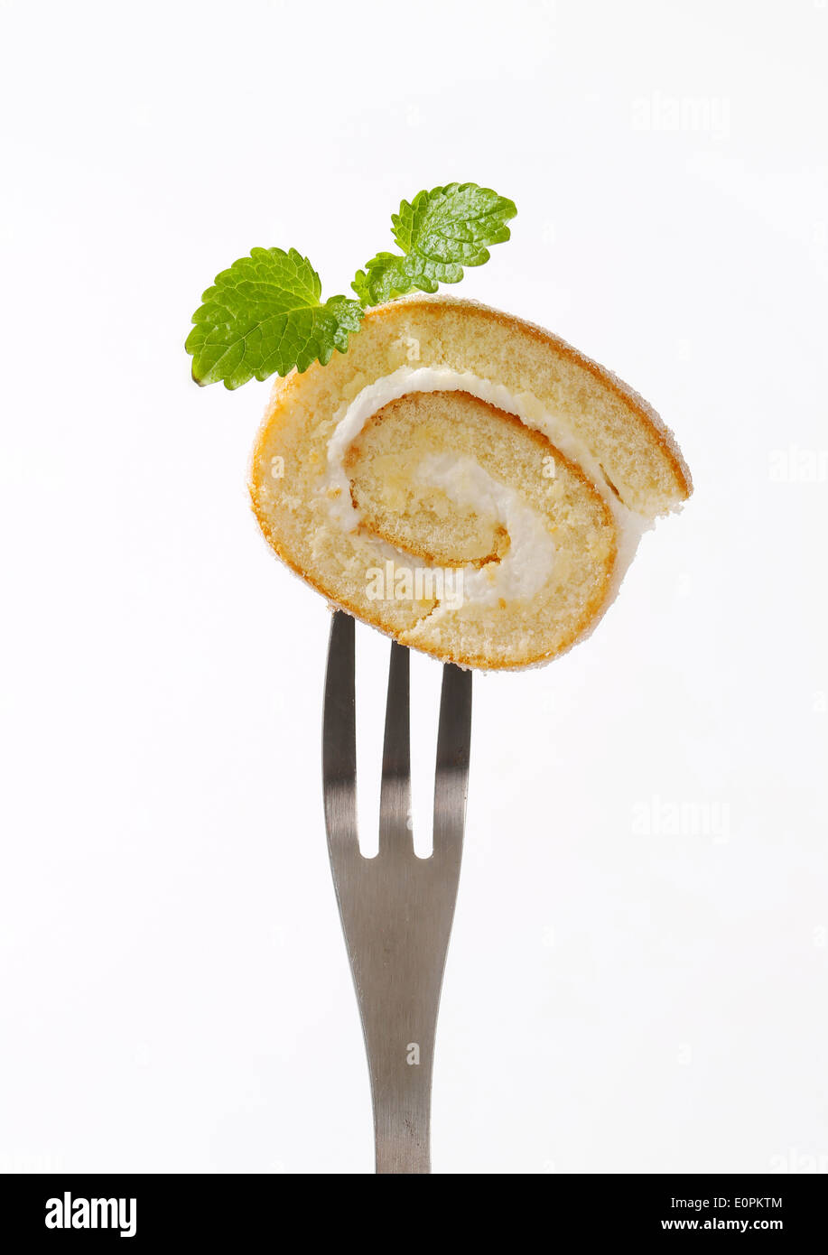 Sponge cake roll with cream filling Stock Photo Alamy