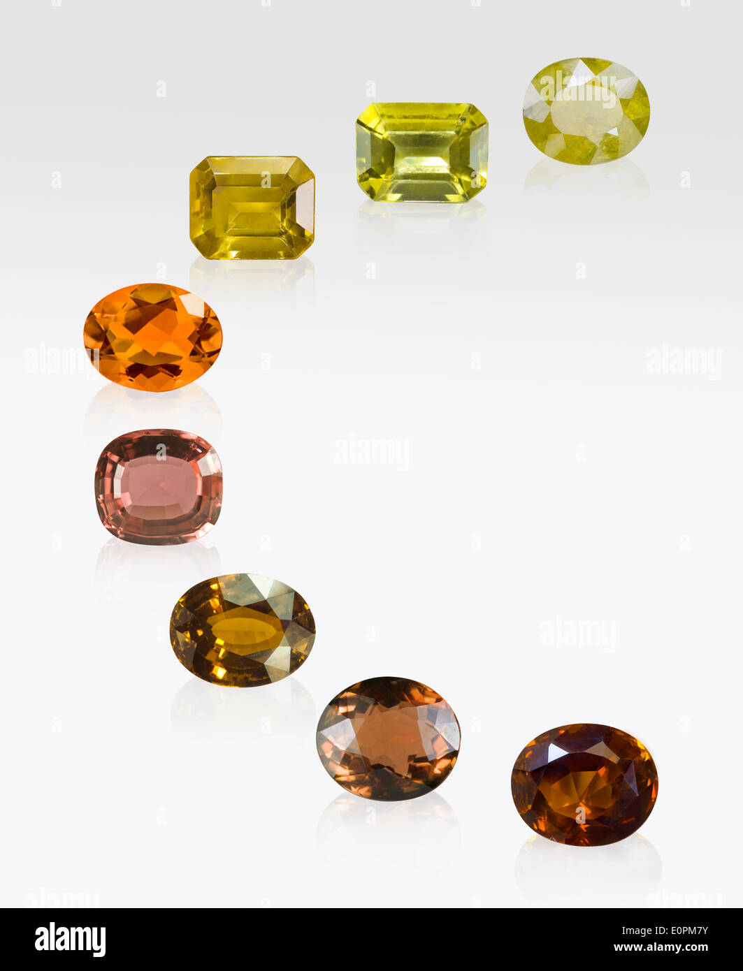 Yellow, Brown and Orange Tourmaline gems on white background Stock Photo