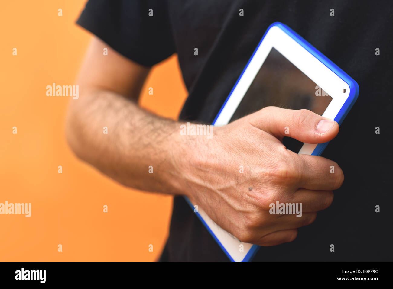 Male Hands with tablet computer. Using modern technology gadgets. Stock Photo