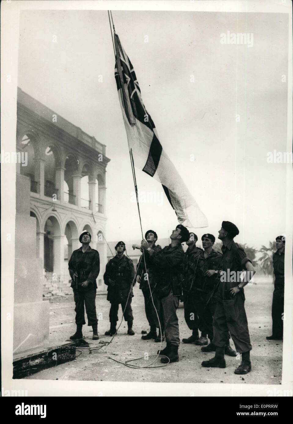 Nov. 11, 1956 - Commandos Take Navy House In Port Said. Commandos raise the White Ensign over Navy House, Port Said, ten minutes after capturing the building in heavy fighting. Egypt announced that fierce fighting broke out again in Port Said and had continued. Stock Photo