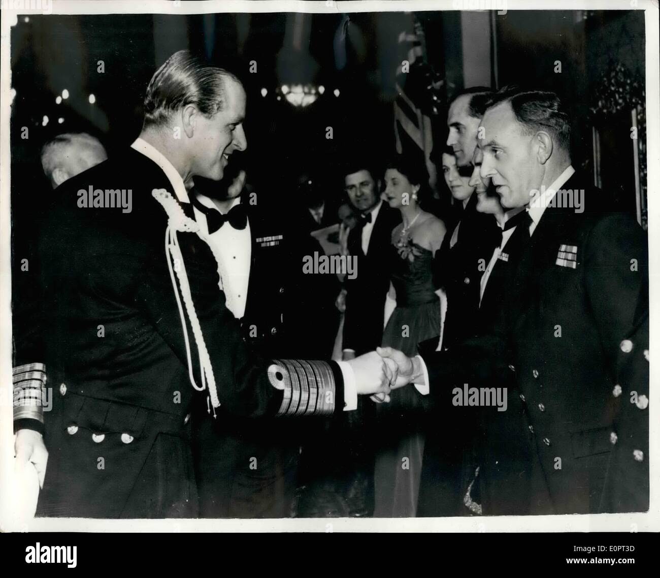 Feb. 02, 1957 - THE DUKE ''DROPS A BRICK''.....ATTENDS PREMIERE ''YARGTSE INCIDENT'' PRINCE PHILIP, DUKE OP EDINBURGH chatted to officers and men who took part in the film ''YANGTSE INCIDENT'' - after the premiere of the film at the Plaza Cinema last night.. One of the men he spoke to was CHIEF PETTY OFFICER lEOHARD WILLIAMS who was senior engine room artificer in the '''Amethyst'' - the ''hero chip'' of the film. He asked Williams what ship he was serving with now - and Williams replied - ''In the Royal Yacht, sir. I've been with her for three and mumbled an half yea., eir''. Stock Photo