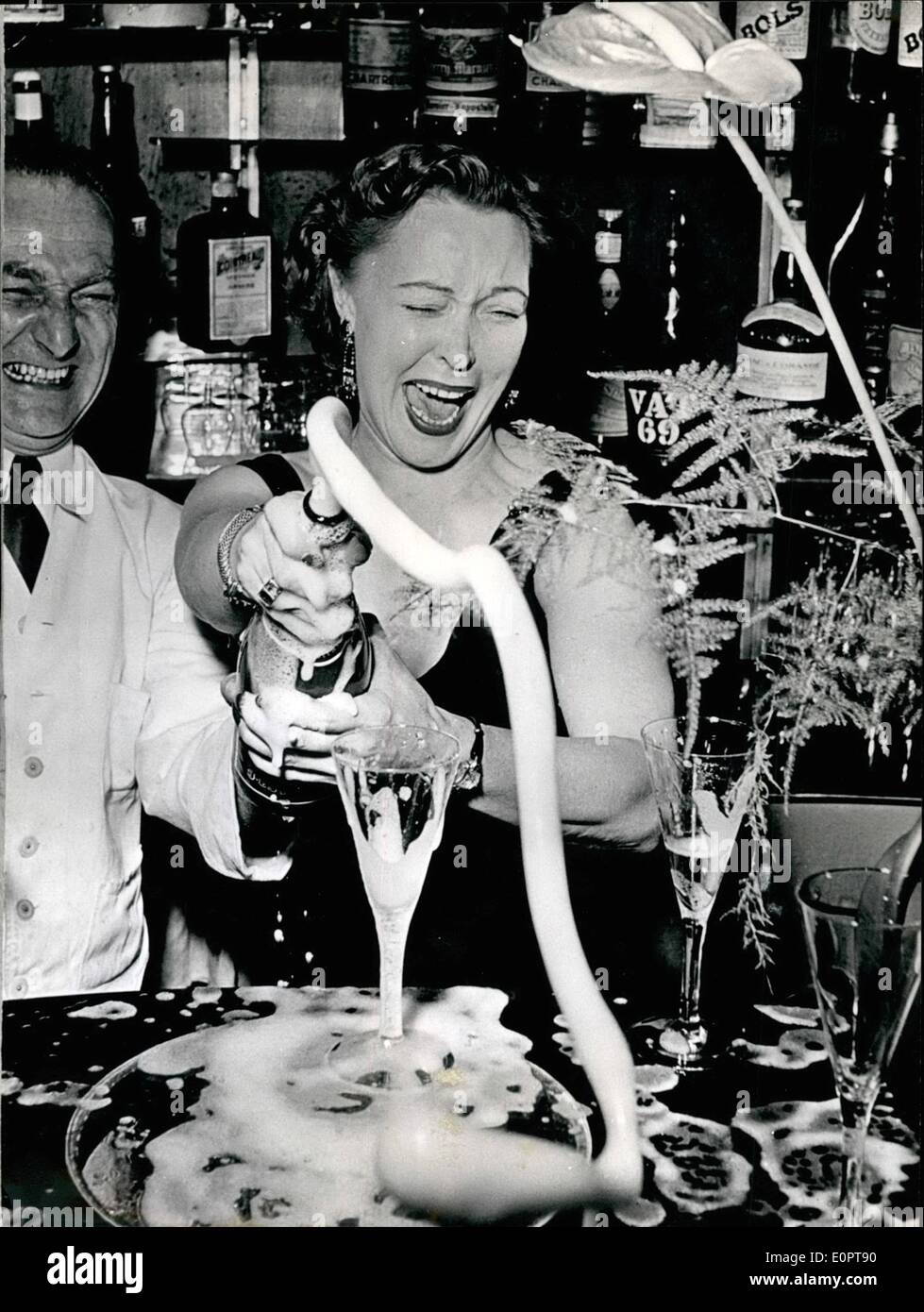 Dec. 12, 1956 - Happy New Year!: The actress Hilde Sessak Hilde Sessak greats the New Year by opening a bottle of champagne. Stock Photo