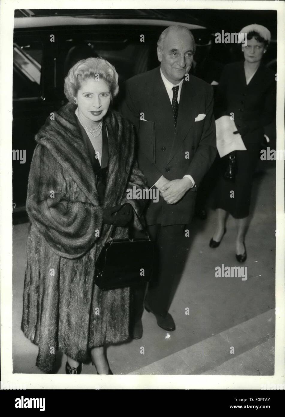 Dec. 12, 1956 - Sir Bernard and Lady Docker attends B.S.A. meeting continue struggle to Reinstatement: Sir Bernard and Lady Docker attended the Annual meeting of the Birmingham Small Arms Group at Winchester House in the City this morning. This is the first annual meeting of the BSA since Sir Bernard was dismissed as Chairman and Managing Director in May. Sir Bernard is expected to continue his struggle to get back his old job as Chairman. Photo Shows Sir Bernard and Lady Docker arriving for the meeting this morning. Stock Photo