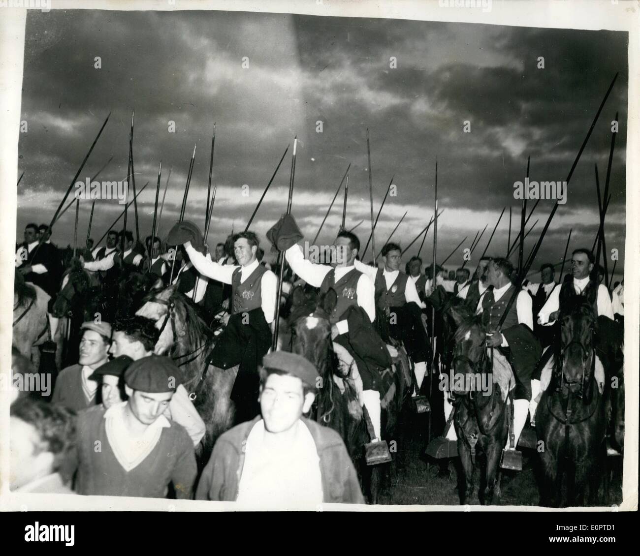 Feb. 02, 1957 - Queen Visits Bull Farm - Villa Franca - Portugal. Photo shows Scene during the Queen's visit to the Bull Farm, Vila Franca, Portugal - showing some of the mounted ''Campinos'' - who waves their long poles in greeting. Stock Photo