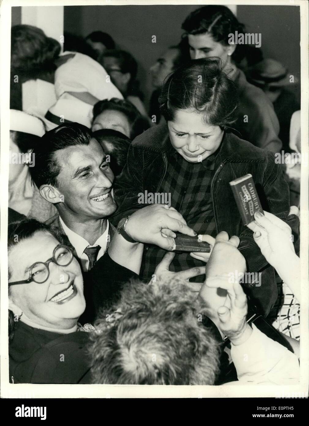 Dec. 12, 1956 - It is great to be free but she cannot help the tears.: Tears of emotion pour down the face of a little Hungarian girl when she was greeted by lots of kindness on arrival with her Hungarian refugees at Mascot airport, Sydney - Australia at the end of the their flight to Freedom. Stock Photo