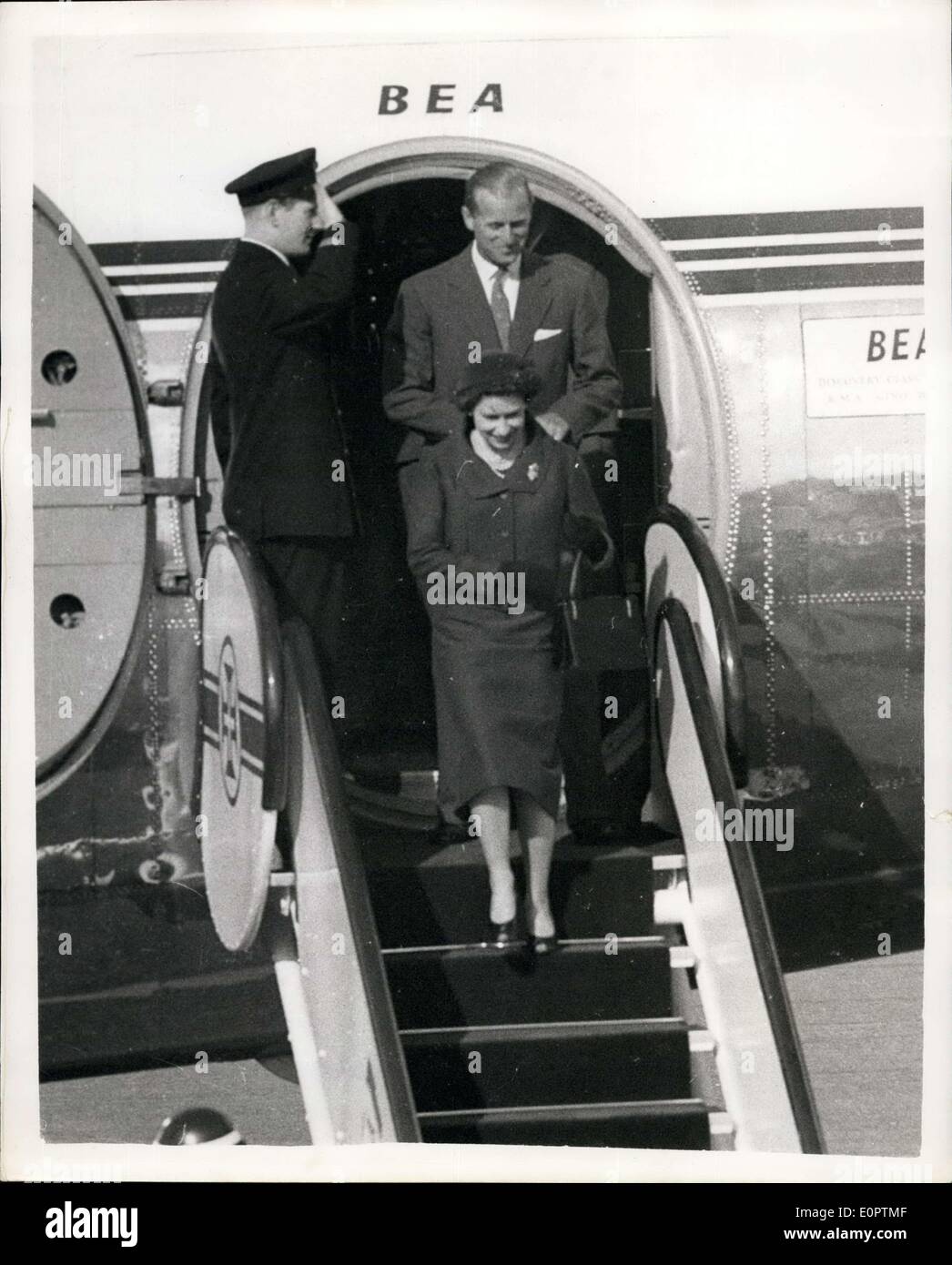 Feb. 18, 1957 - Queen and Duke Reunited: H.M. The Queen and The Duke of Edinburgh who have been parted for four months while the Duke has been on his Commonwealth tour - were reunited on Saturday at Montijo airfield, near Lisbon on Saturday. Their state visit to Portugal starts today (Monday). Photo shows The Queen and The Duke of Edinburgh leaving the aircraft to Montijo airfield, after the Queen's arrival. The Duke had boarded the plane to greet her. Stock Photo