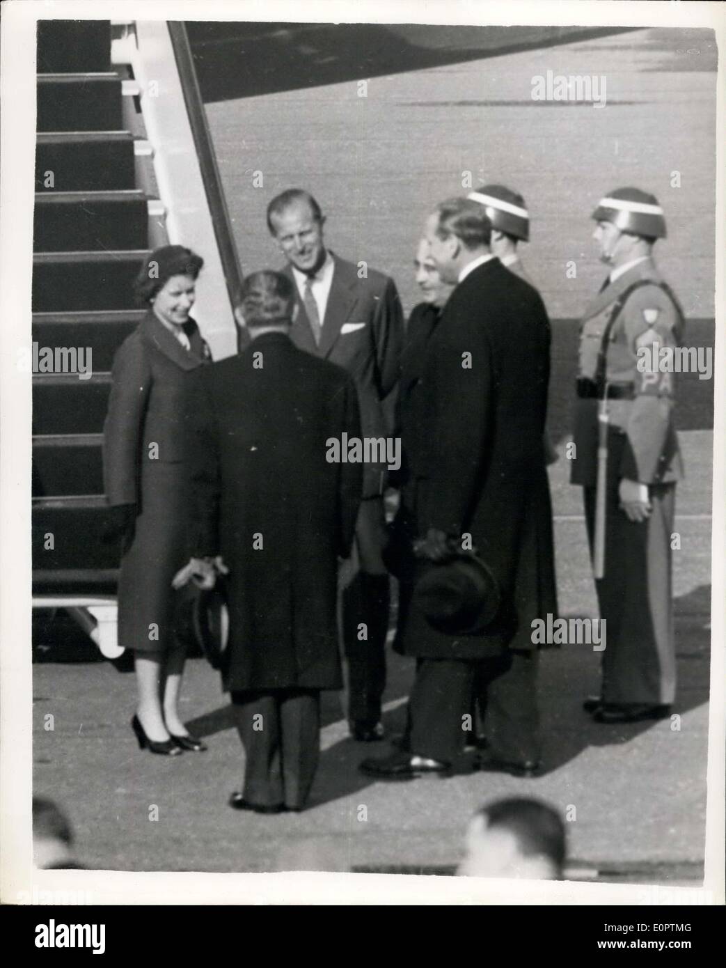 Feb. 18, 1957 - Queen and Duke of Edinburgh Reunited: H.M. Th Queen and The Duke Of Edinburgh who have been ported for four months while the Duke has been on his Commonwealth tour were reunited on Saturday at Montijo airfield,. near Lisbon on Saturday. The queen had flown from London - and the Duke was at the airfield to greet her. Photo Shows The Duke Of Edinburgh and H.M. The Queen talking to officials at Montijo airfield. Stock Photo