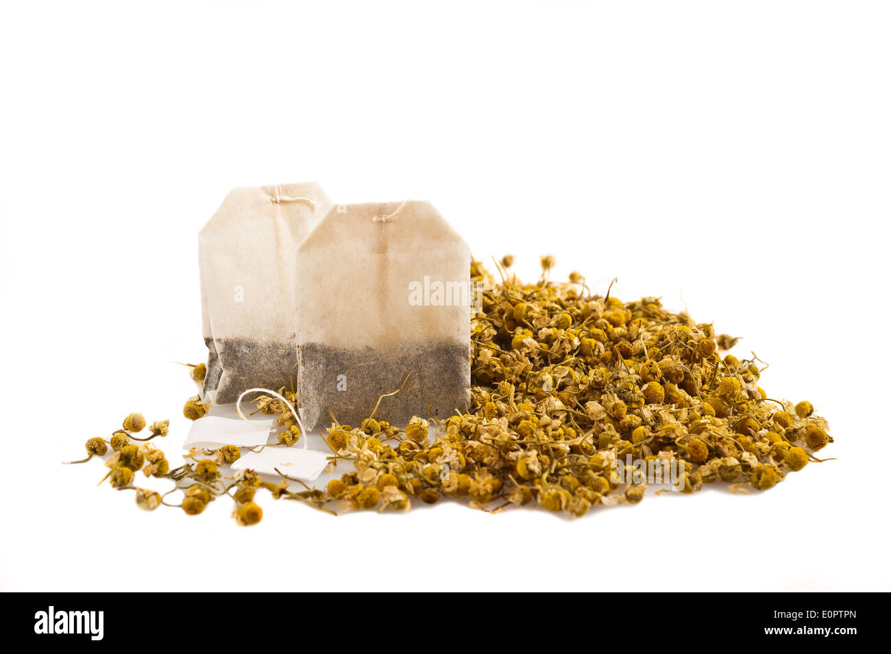 Sachets and chamomile flowers on white Stock Photo