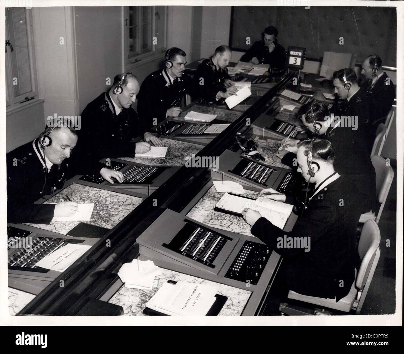 Dec. 28, 1956 - Scotland Yard's New Information Room: Scotland Yard's new Information Room has been designed to meet the great increase in 999 calls and to accommodate the new mechanically and electrically aided system of working now to be employed. It deals with incidents in the whole of the Metropolitan and City Police districts - an area of 736 square miles and a population o 81/2 million. The Information Room is a clearing centre where information about matters requiring police attention is received and distributed Stock Photo