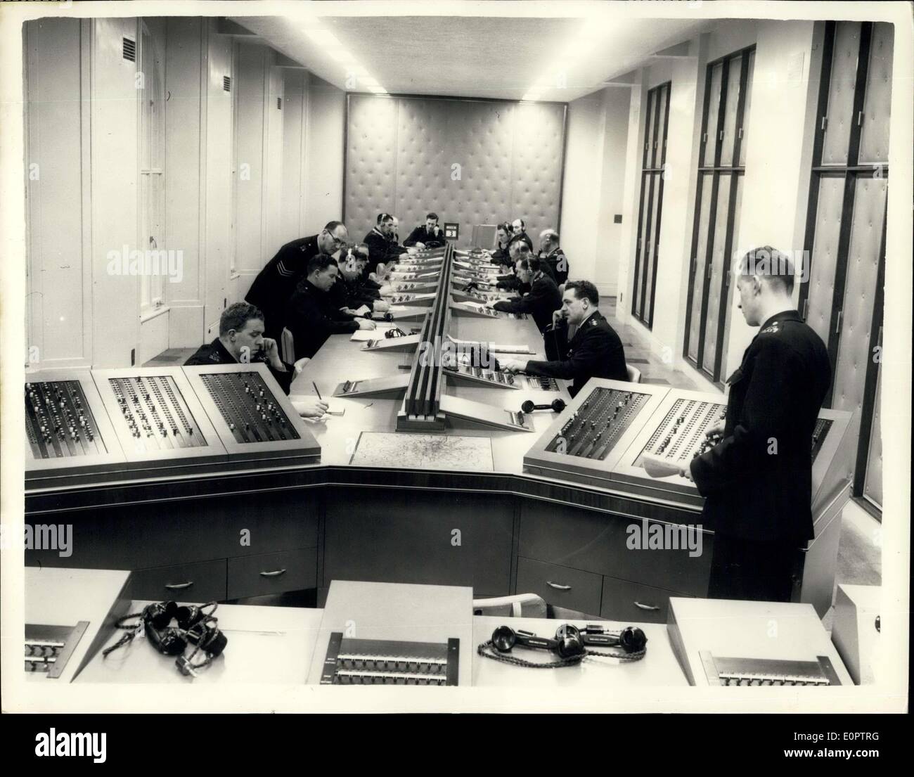 Dec. 29, 1956 - Scotland Yard's New Information Room: Scotland Yard's new Information Room has been designed to meet the great increase in 999 calls and to accommodate the new mechanically and electrically aided system of working now to be employed. It deals with incidents in the whole of the Metropolitan and City Police districts - an area of 736 square miles and a population o 81/2 million. The Information Room is a clearing centre where information about matters requiring police attention is received and distributed Stock Photo