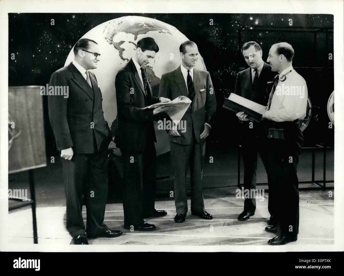 Jan. 01, 1957 - DUKE OF EDMIBURCIR OPENS INTERNATIONAL GEOPHYSICAL YEAR ON TELEVISION.. H.R.H. The DUKE OF EDINBURGH vas the central figure at the B.B.C. Television programme - presented last night to officially open the International Geophysical lean. A similar broadcast is being made by President Eisenhower in the United States.. The Year - actually lasts for eighteen months - and countries from all pawl of the vorld are taking part.. Information regarding the outer atmosphere and other unknown phoneme-la is sought. Stock Photo