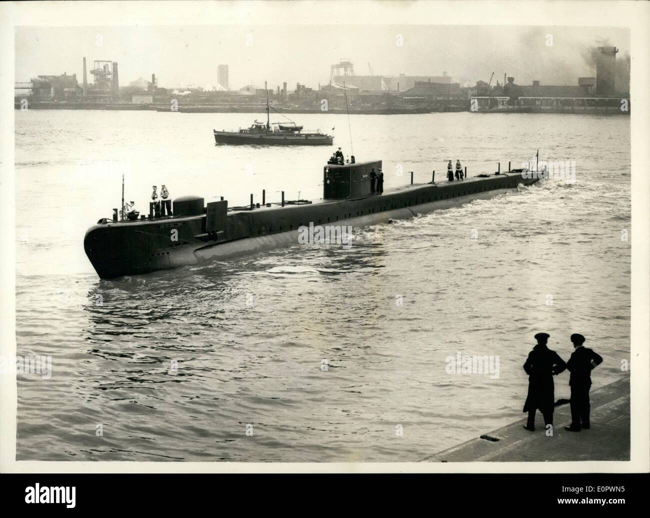 Mar. 03, 1957 - Britain's Newest Experimental Submarine in London H.M.S. Explorer... Visiting the West India Docks is the British experimental submarine H.M.s. Explorer... She is 225 feet long and has a squat streamlined conning tower. She is unarmed and uses high test peroxide in her propulsion engines - and is said to have reached a speed of 25 knots under water. A German experimental team led by Professor Helmut Walther collaborated with British designers when the vessel was under construction. she will remain in London for about a week - but will not be open to the public Stock Photo