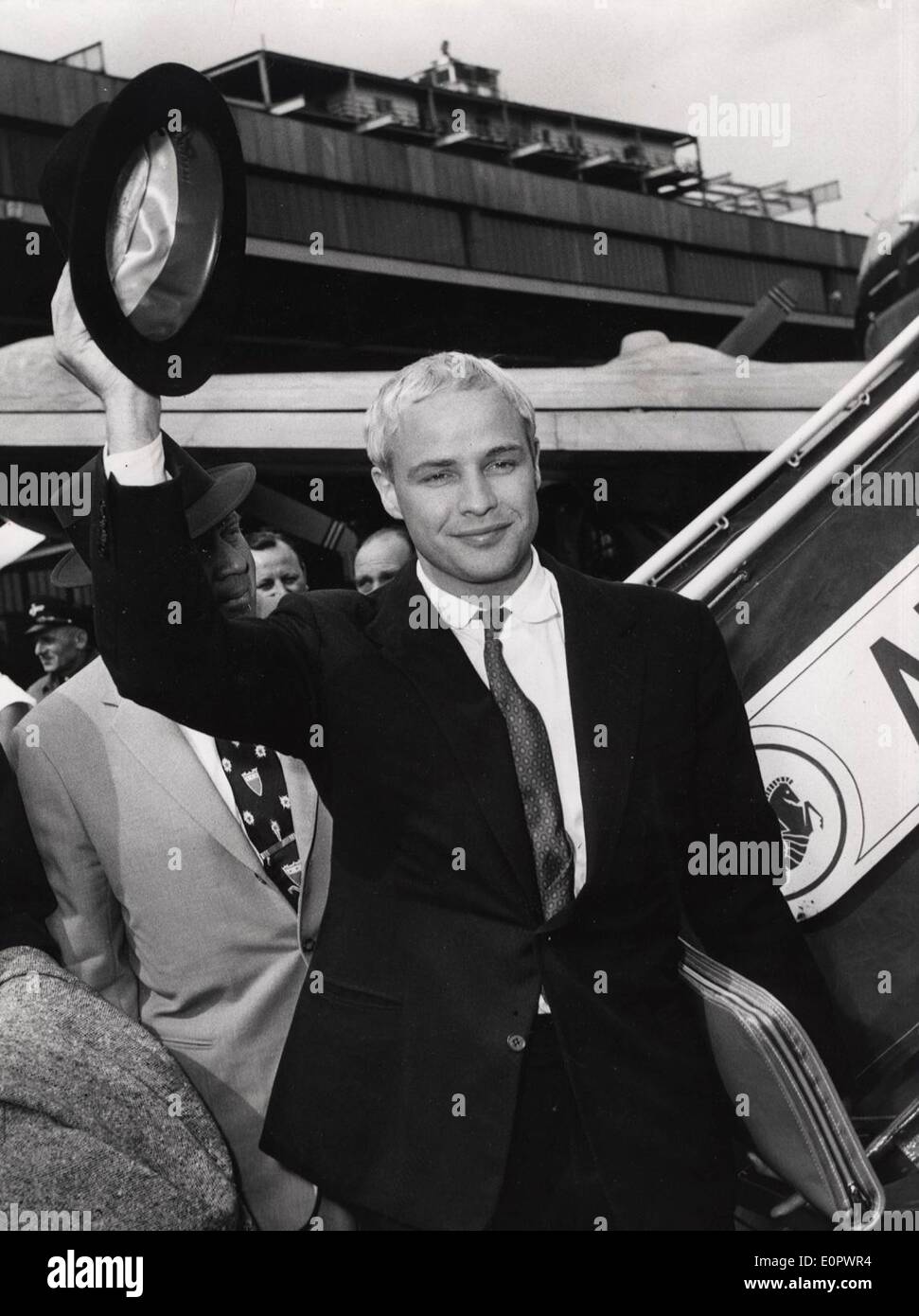 Jan. 01, 1957 - Berlin, Germany - Legendary actor MARLON BRANDO has died at age 80 of unknown causes in Los Angeles. His long acting career included movies such as 'A Streetcar Named Desire,' 'Apocalypse Now,' the X-rated 'Last Tango in Paris' and (pictured) his infamous 'The Godfather.' Pictured arriving in Berlin. Stock Photo