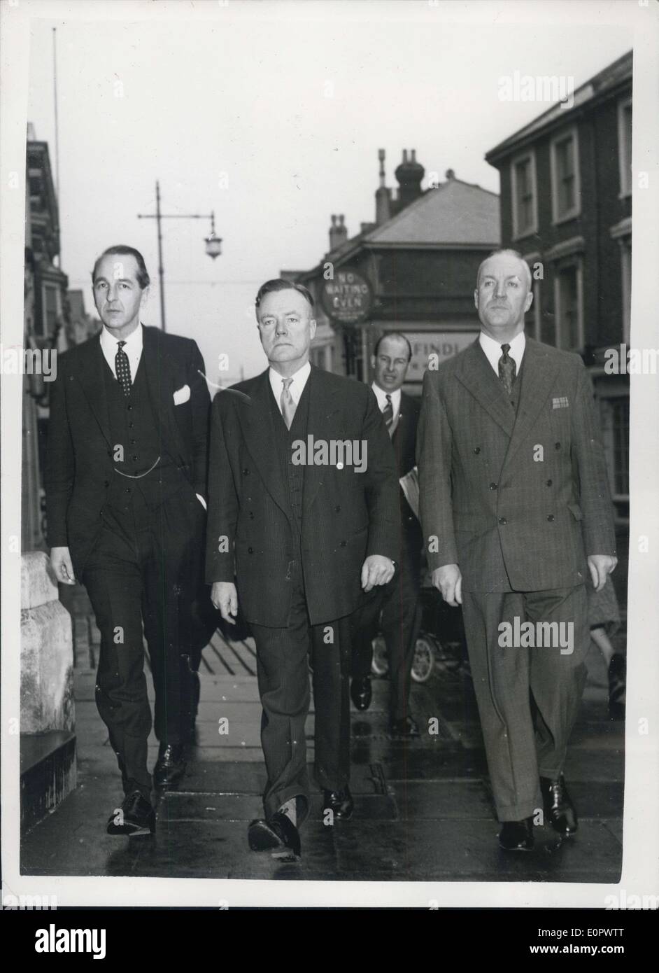 Jan. 14, 1957 - Dr. John Bodkin Adams appears at Eastbourne Prosecution and Det. Hannam. Dr. John Bookin Adams appeared in court at Eastbourne today charge with the murder in November 1950 of Mrs. Edith Alice Morreill (81) a former patient. He also faces 16 other charges. Photo shows Members for the Prosecution - in East bourne this morning. Left to right Mr. M. Morris, Mr. M. Stevenson Q.C. - and Det. Supt. Hannan - who investigated the Eastbourng happenings which ended in the arrest of Dr. Adams. Stock Photo