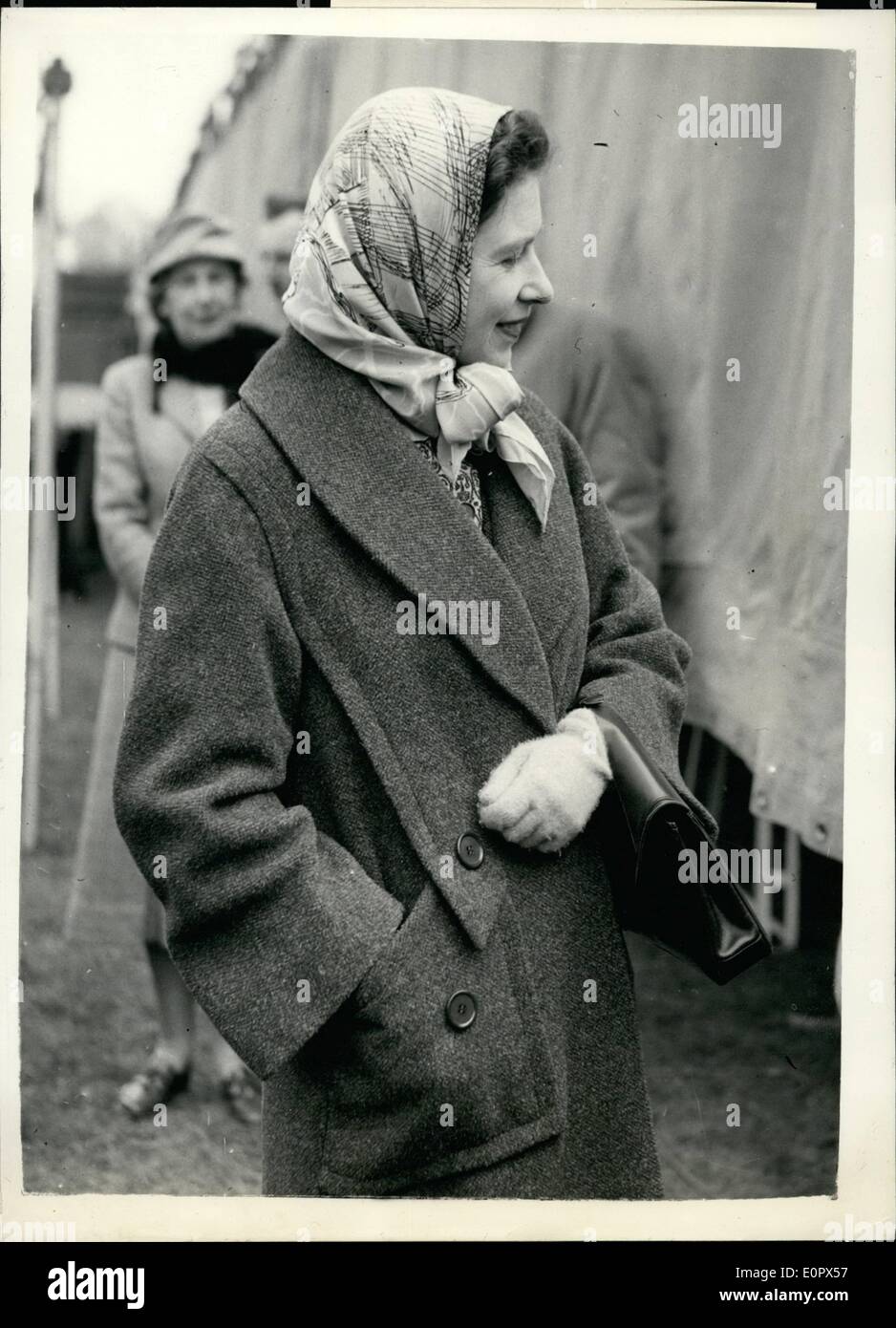 Apr. 04, 1957 - Queen Elizabeth At Badminton Horse Trials Final Day H.M. THe Queen, hand deep in pocket of her coat, and wearing a headscarf-when she watched the finals at the Badminton Horse trials today-the last day. Stock Photo
