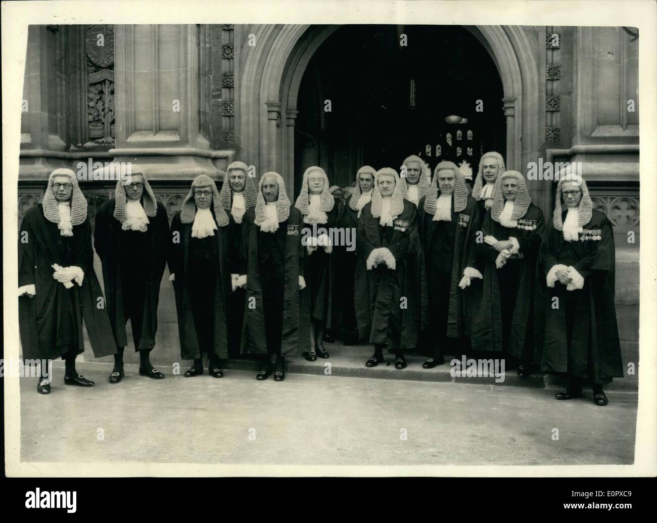 Apr. 04, 1957 - New Q.C.'s Sworn In At House Of Lords: 47-year old Miss Dorothy Knight Dix was among the newly appointed Queen's Counsels, who were sworn in today at the House of Lords. She was called to the Bar in 1934 and in 1946 was sworn in as the first woman barrister to sit as Recorder. Keystone Photo Shows:- New Q.C.'s seen leaving the House of Lords after today's Swearing in. Stock Photo