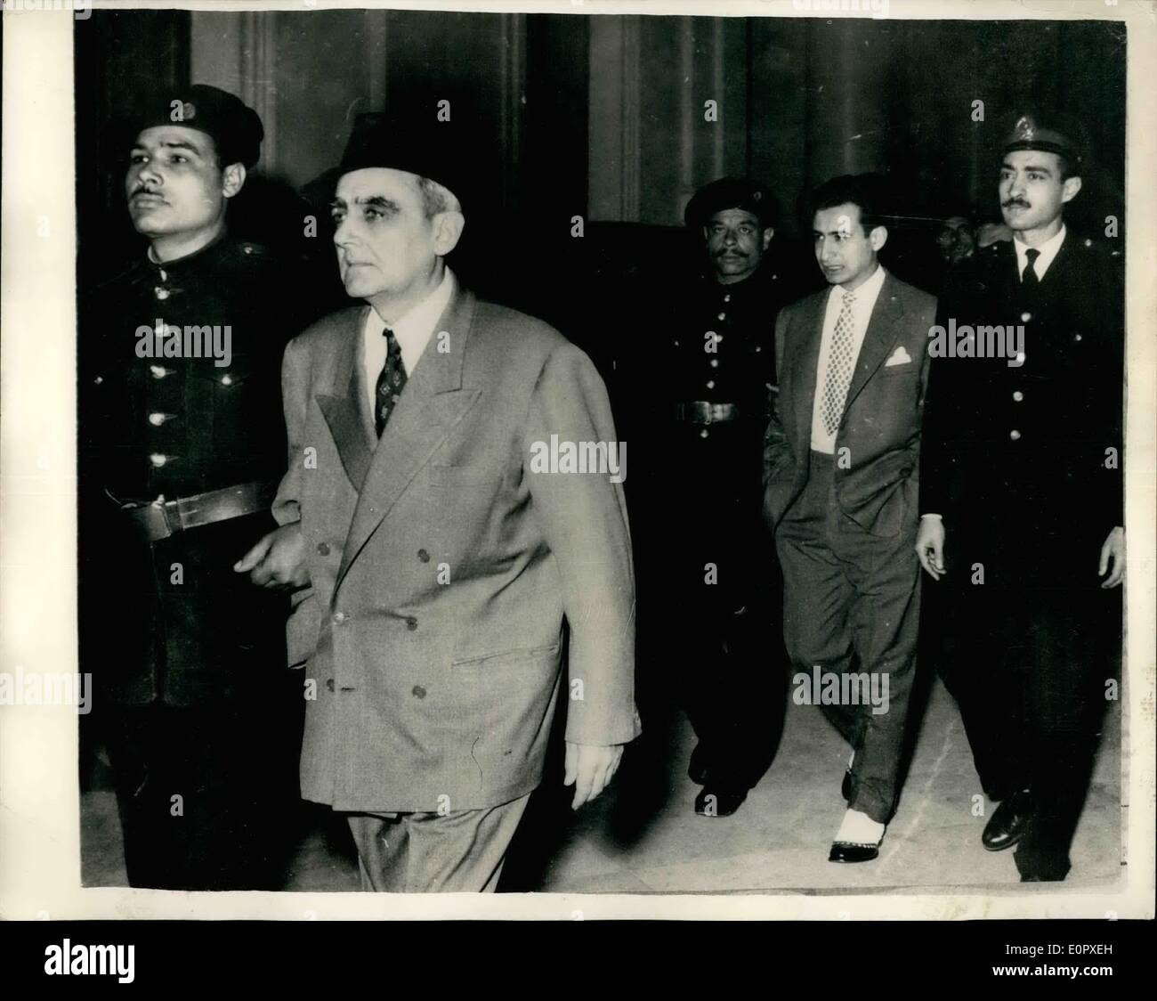 Apr. 04, 1957 - Cairo Espionage Case Adjourned one again. Yugoslavian and Egyptian accused arrive.: The Trial of 20 persons - including Mr. James Swinburn former business manager of the Arab News Agency opened in the Assize Court, Cairo. The hearing lasted about fifteen minutes at the end of which the case was postponed until May 11th. Photo shows Col. Gregorovitch the Yugoslavian accuses - arrives at the court followed by Capt. Loutfi, ex-officer of the Egyptian marines. Stock Photo