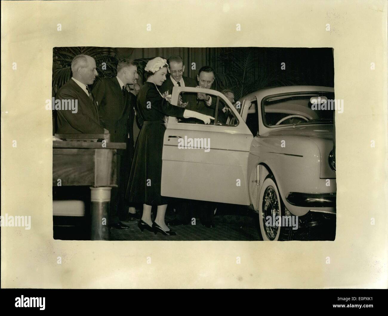 Apr. 10, 1957 - During her visit to the Regie Renault de Flins factory with her husband Prince Philip, Queen Elisabeth admired the ''Dauphine'' for a long time, which was offered to her. The car is light blue with a navy blue leather interior. Stock Photo