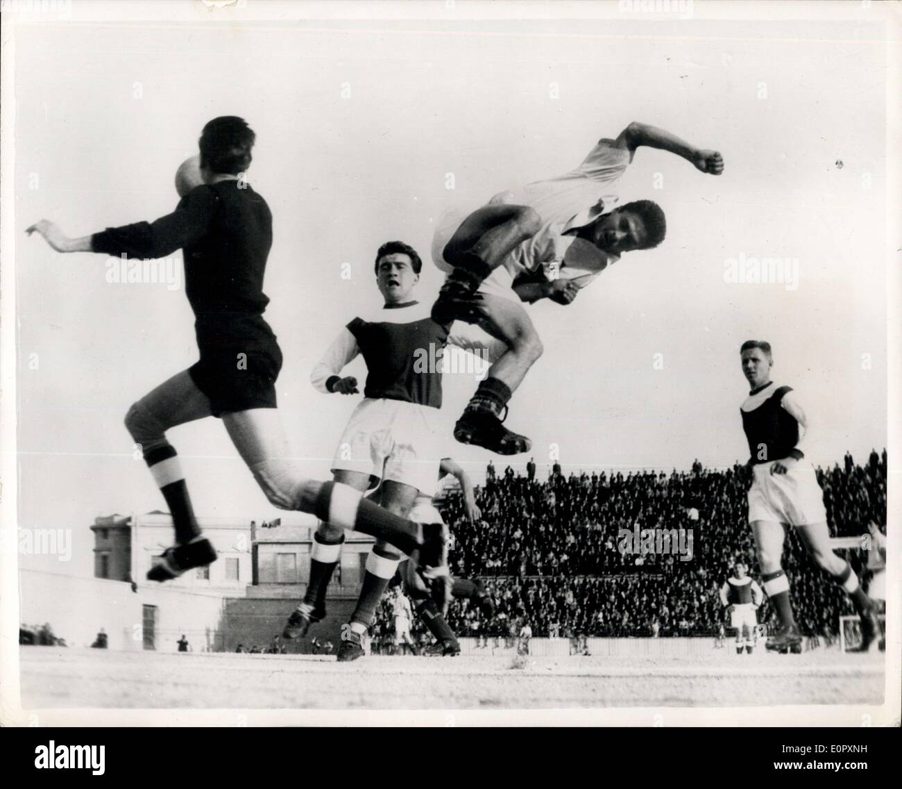 Apr. 27, 1957 - Action. The ?Free Hungarian? football team made up of well known refugee footballers, beat the Greek team Ethnikos by seven goals to win in Athens. Photo Shows: The Free Hungarian goalkeeper gets the ball away from an agile Ethnikos player, during the match. Stock Photo
