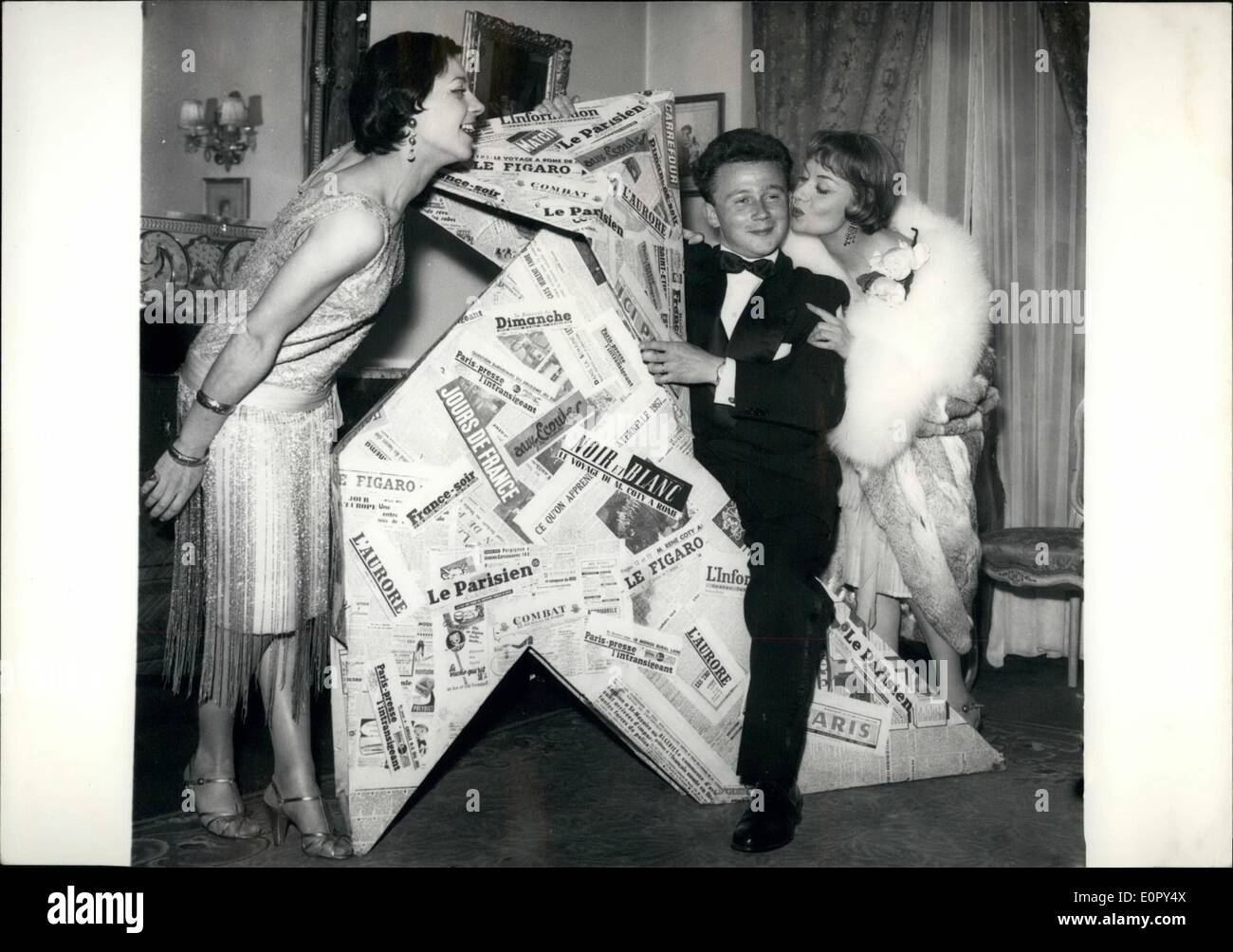 May 05, 1957 - Philippe Bouvard Best Paris Communist: Philippe Bouvard from ''Le Figaro'' was proclaimed by a jury the best Paris Communist. Phot Shows the newspaper reporter seen here with Jacqueline Gauthier and Rosine Lucuet, two young actresses, at Lassere's where the prize was a arded this morning. Stock Photo