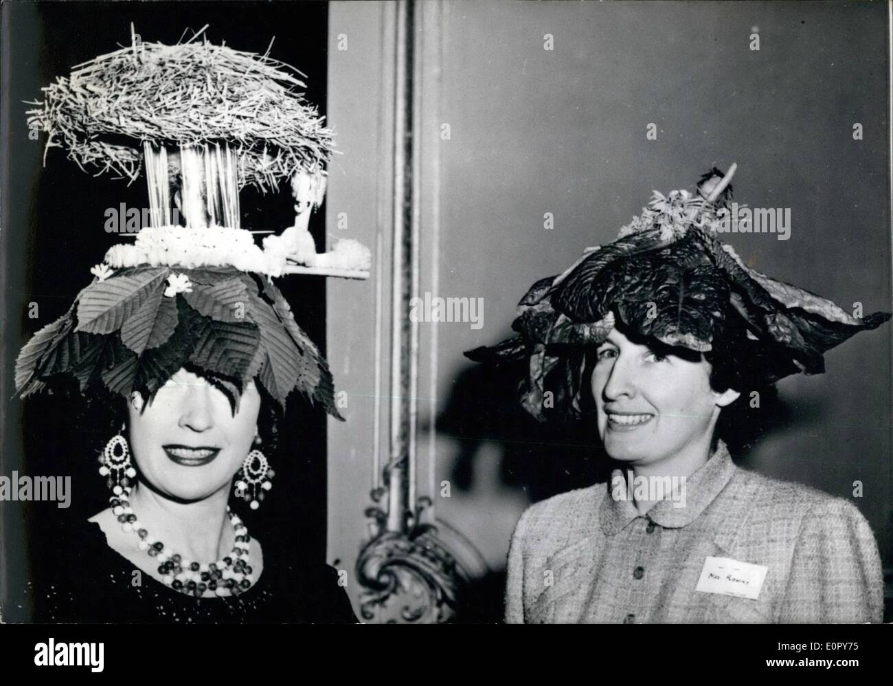 May 05, 1957 - Mad hatters party ay Shape Village.: A 'mad hatters party'' was held at Chateu d'Hennemont, the Shape Village yesterday. Photo shows two of the fancy hats seen at the ball. Stock Photo
