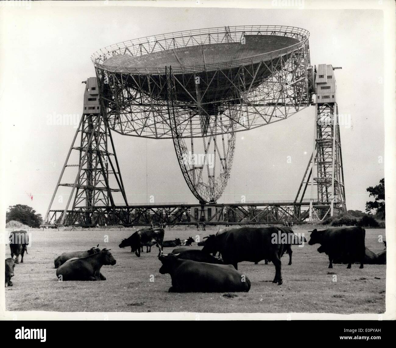 Jun. 26, 1957 - Largest Radio Telescope In The World For Scientific Research Into The Atmosphere: the largest Radio Telescope in the World was shows to the Press yesterday for the firer time. Built at Jordell Bank, Cheshire for Manchester University - at a cost of about 50,000 - it consists of a gigantic copper mesh bowl Weighing 50 tone and suspended between two towers 180 ft. high. Funds for its construction were provideby the Department od Scientific and Industrial Research and the Nuffield Foundation. The diameter of theb bowl 250ft. - and the searil masts are 621/2 ft. high Stock Photo