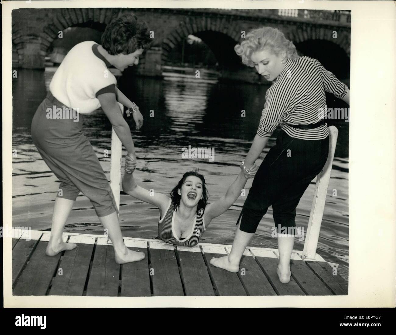 May 05, 1957 - Television lovelies rehearse by the river. B.B.C. ''Pleasure boat'' series.: Three lovely young ladies are busy on the river at Maidenland rehearsing for the new B.B.C. series (TV) ''Pleasure Boat'' starting on May 31st. They are June Wilkinson (17) of Eastbourne - RIta Joyce (20) of Shepherd's Bush and Anette Donati (20) of Leeds. With three others they will cruise down the river accompanied by Kenneth Horne - Michael Holliday and George Martin Stock Photo