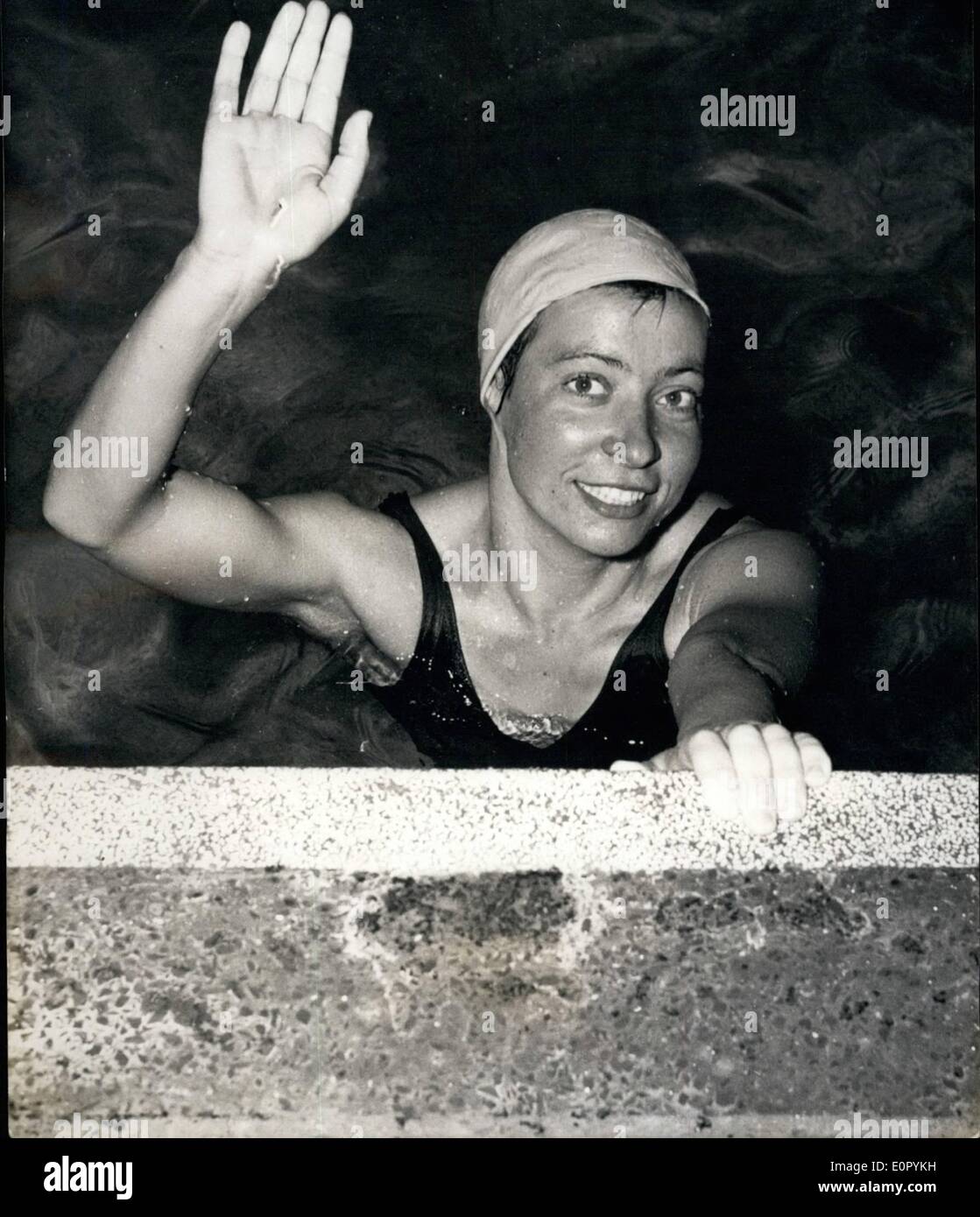 Jul. 07, 1957 - Thomas set a new record for the 1,500 meter freestyle swim. Her time was 3 seconds better than Ginette Jan's, who held the previous record. She also improved her own record in the 800 meter race. She is pictured right after her victory at the side of the Stock Photo