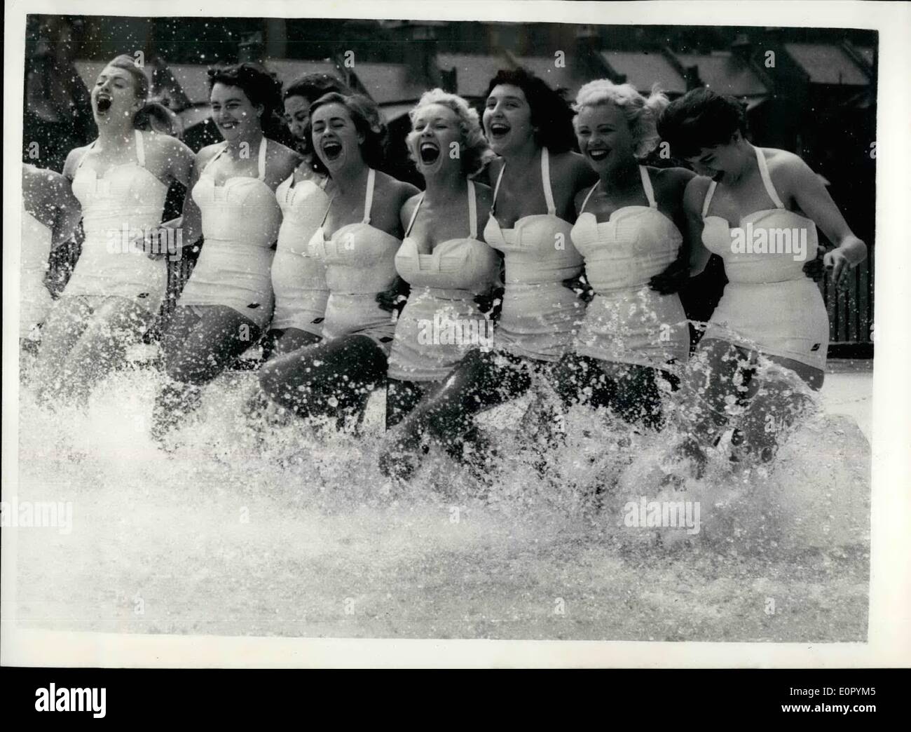 Jul. 07, 1957 - The Commonwealth Aqua Ballet in Training.: Members of the Commonwealth Aqua Ballet Team were to be seen rehearsing at the Nom Sea open air Baths this morning. The girls come from all parts of the Commonwealth and leave - later today for a tour including Rome - Naples and San Rome. Photo shows Members of the Commonwealth Aqua Ballet have fun in the water - during training this morning. Stock Photo