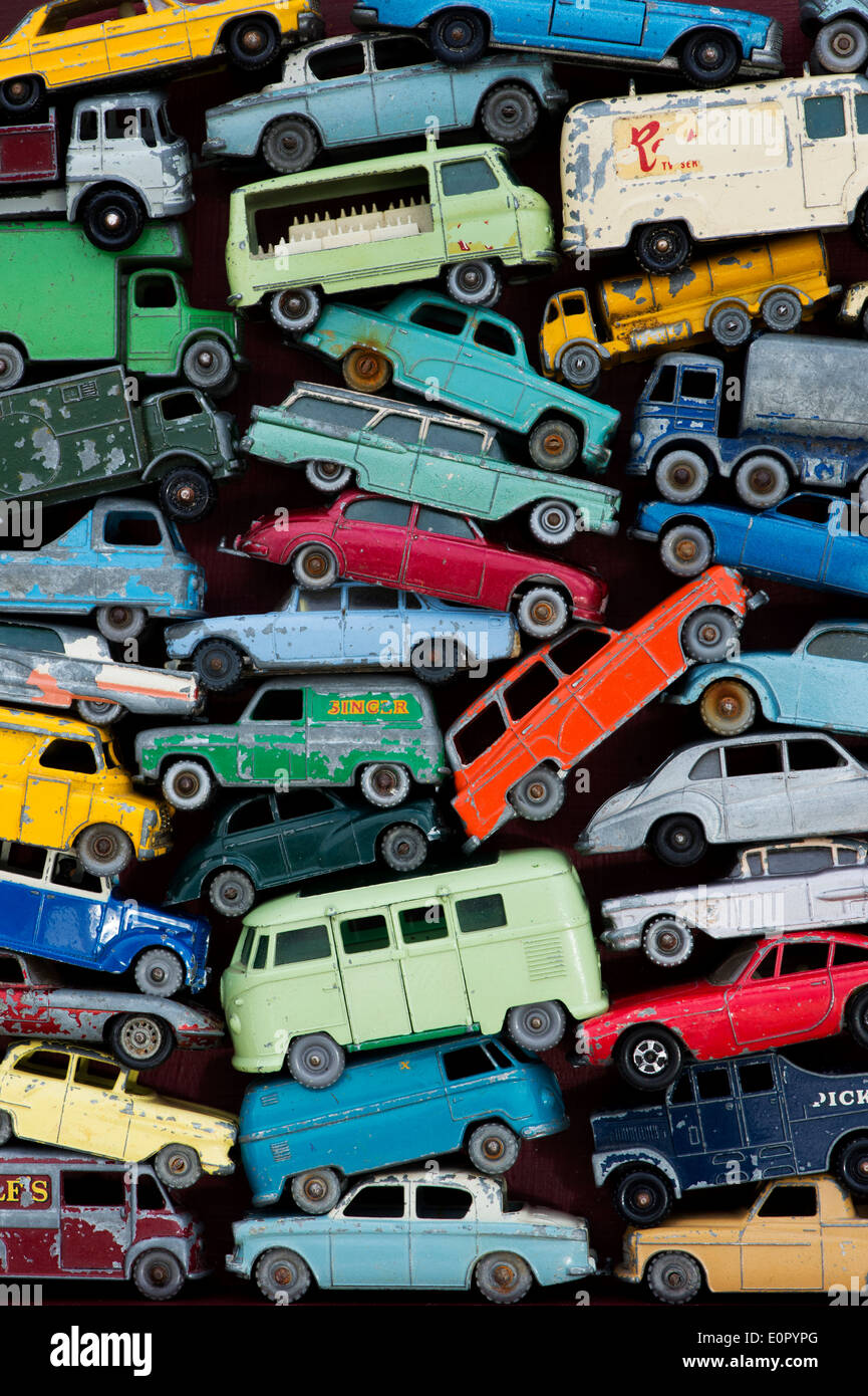 Old playworn Dinky, Matchbox Lesney toy cars, buses, motorbikes pattern Stock Photo