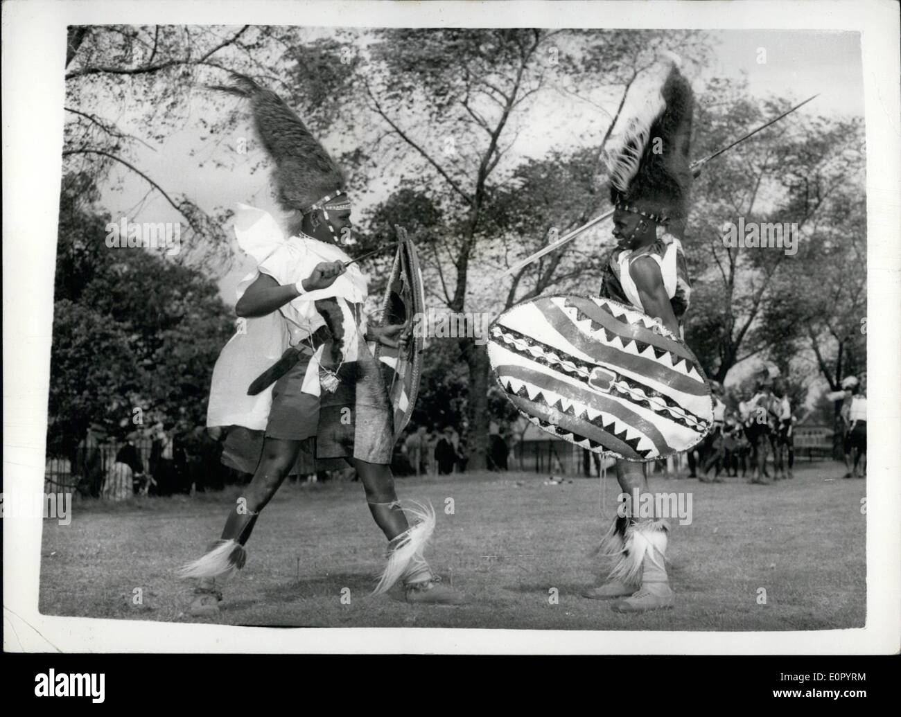 May 05, 1957 - King's Africa rifles rehearses their tribal dance. Prepare for the Royal tournament; Men of the King's African Rifles were to be seen at Woolwich this morning rehearsing the tribal dance which is to be part of their display at this years Royal Tournament. Photo Shows Two men of the K.A.R. seen as they rehearse a ''duel'' - part of their tribal dance at Woolwich this morning. Stock Photo