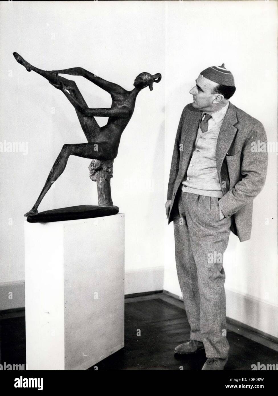 May 27, 1957 - Mascherini is looking after his sculptures, which are exhibited in the Stadtische Galerie of Munich. 30 sculptures, among them big figures from Italy, give a view of the work of the 50 year old Triestine. Photo shows Marcello Mascherini (Marcelo Mascherini) in front of his sculpture ''The Bathing' Stock Photo