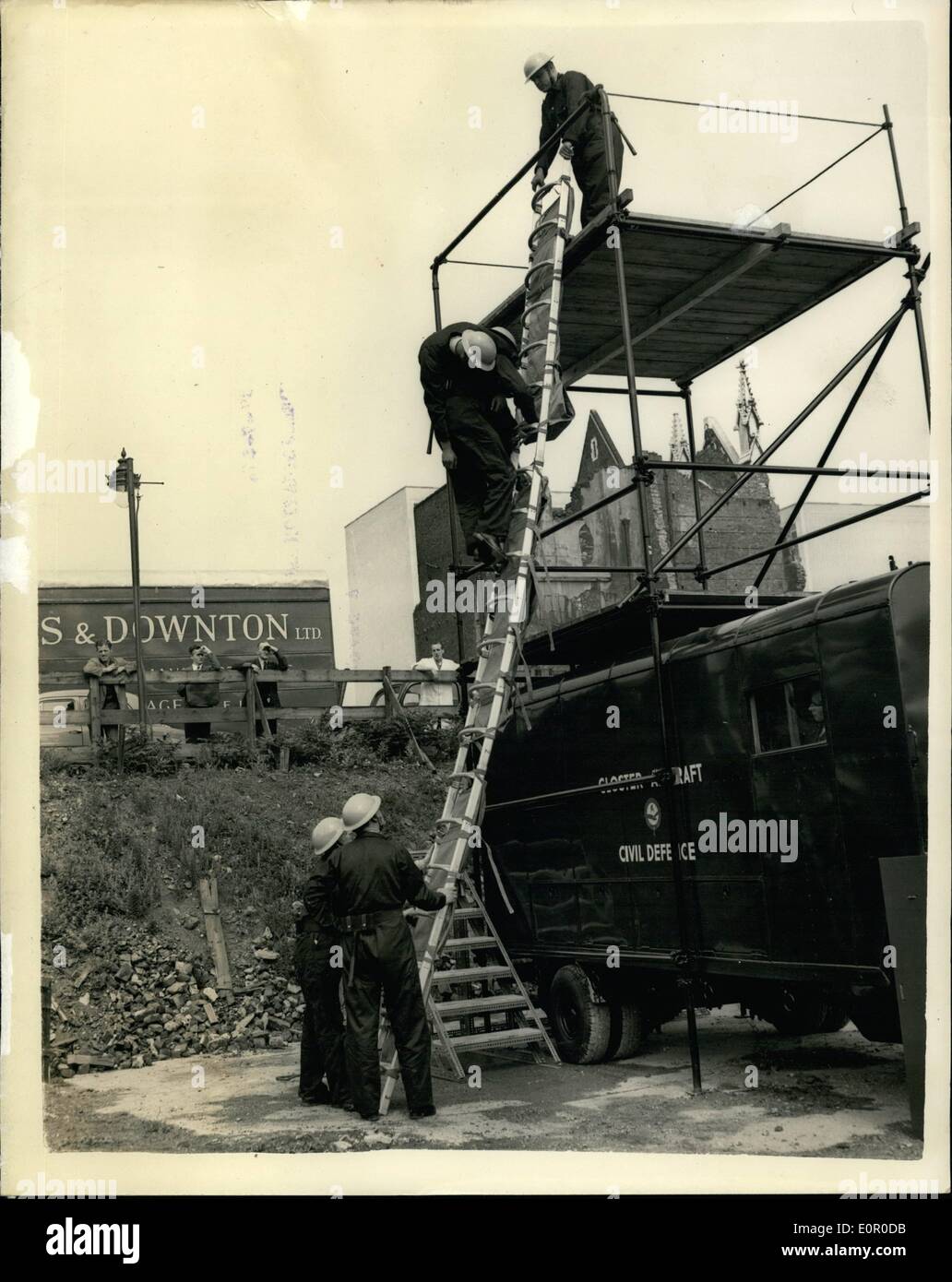 Jul. 17, 1957 - 17-7-57 Demonstration of unique life-saving stretcher ladder. A revolutionary life-saving stretcher-ladder evolved by Gloster Aircraft Company, was demonstrated in London this morning. It is ideal for lowering casualties from upper windows or the side of a ship, can be tilted to pass through narrow openings and is ideal for mountain rescue. The stretchers can be joined together to form a lightweight ladder. They are extremely light and can be packed into confined spaces Stock Photo