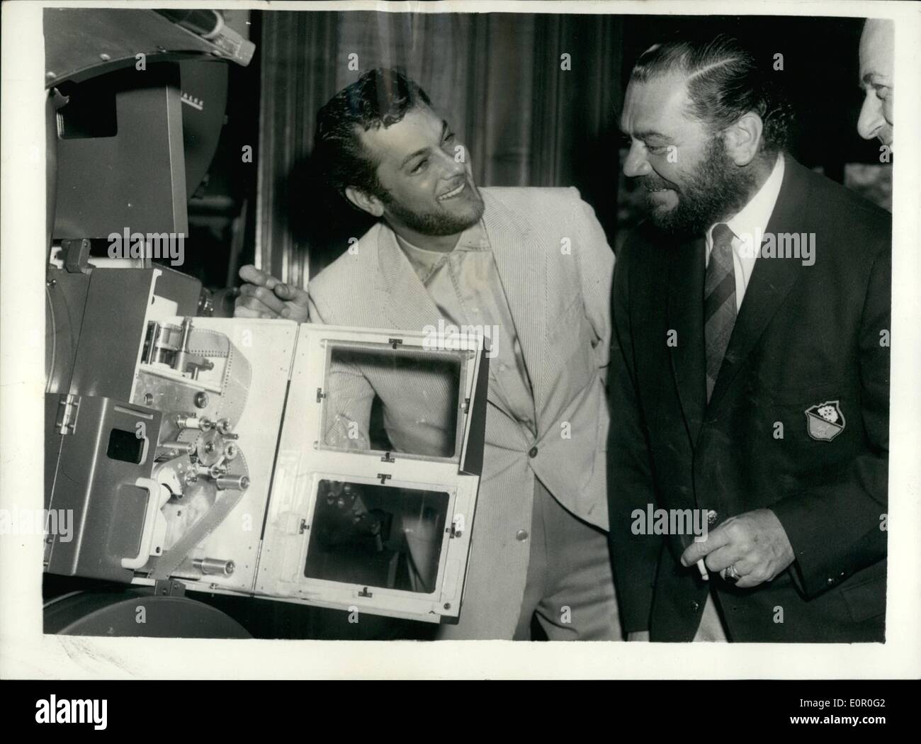 Jun. 06, 1957 - Stars Attend Demonstration of New Technicolor System.. Tony And Ernest - Complete With Beards.. A number of well known stars of the screen attended the demonstration at the Odeon Cinema, Leicester Square of ''Technirama'' - a new Technicolour process - a revolution in the film industry. Keystone Photo Shows: L-R:- Tony Curtis and Ernest Borgnine complete with beard - discuss the meruts of the Technirama projection system - at the Theatre. Stock Photo