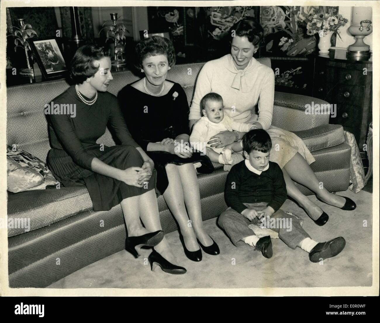 Jun. 06, 1957 - Wife of American Ambassador at Rome. Keystone Photo shows: Mrs. Whitney, center, wife of Mr. John Hay White, the new American ambassador to Britain, pictured at her home residence at Wingfield House, Regents's park, today, with her daughter, Miss Kate Roosevelt, left, and Mrs. Anthony Di'Bonaventura, who is seen with her two children, Andrea, 9 months, and Christopher, 5. Stock Photo