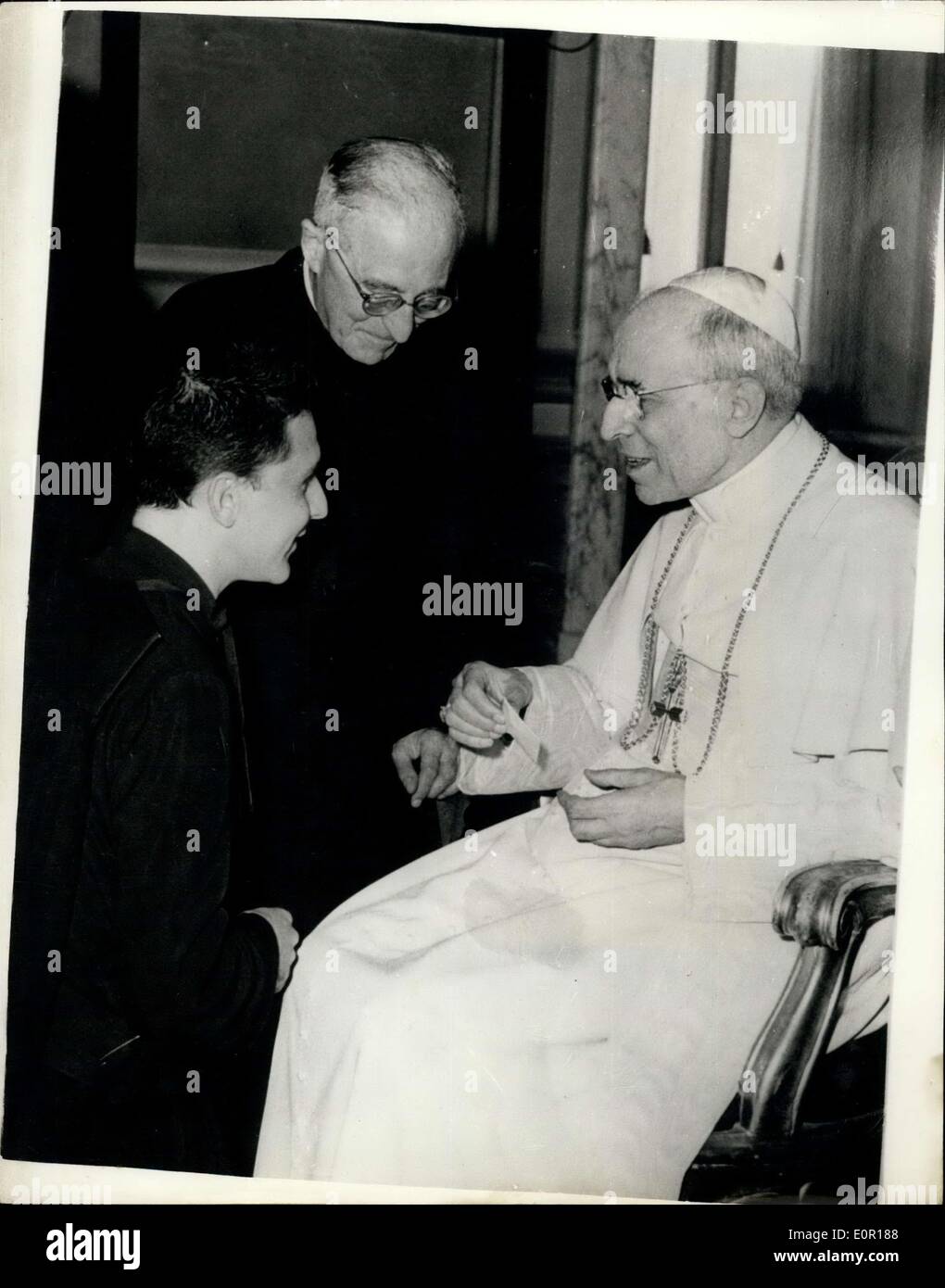 Sep. 12, 1957 - The Pope receives the Jesuits in Rome; His Holiness The Pope received members of the Jesuits when he attends a special meeting at CasterGandolfo. Photo Shows The Pope receives the youngest Jesuit presented to him by the ''Black Pope'' Janssens at Castelgandolfo. Stock Photo