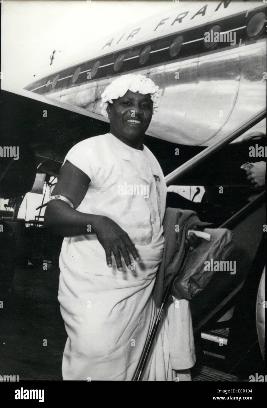 Aug. 08, 1957 - King of Togo Flies Home: Kalipe IT, King of Togo left Paris to day After a short visit to the French Capital. Photo Shows Wearing a Sleeveless white robe and a bonnet , the King of Togo addresses a farewell smile to Paris as he climbs the Gangway leading to the plane. Stock Photo